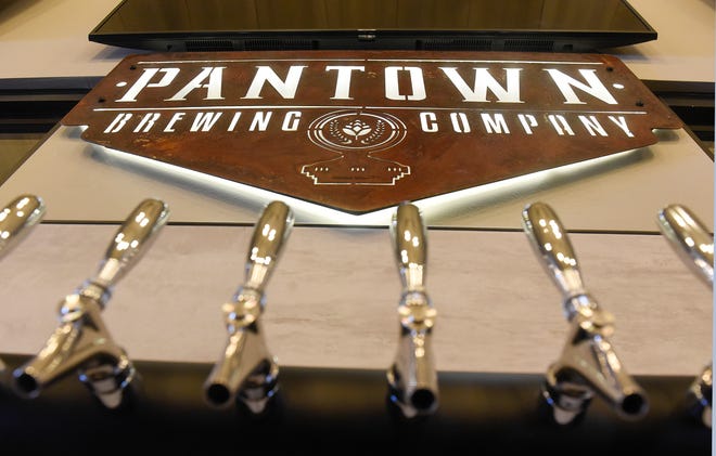 The Pantown Brewing Company logo is installed above taps at the St. Cloud business. 