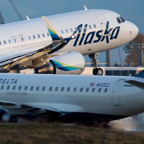An Alaska Airlines Airbus A320 takes off from Seat