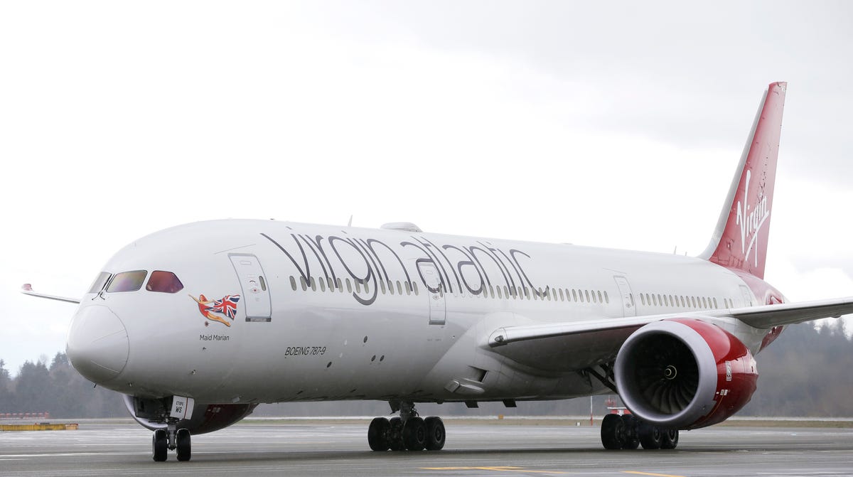 A Virgin Atlantic Boeing 787-9 passenger airplane arrives following a flight from London to Seattle, Monday, March 27, 2017, at Seattle-Tacoma International Airport in Seattle. Sir Richard Branson, the founder of Virgin Atlantic and the Virgin Group, was onboard to help launch Virgin Atlantic's new daily service between London Heathrow and Seattle, replacing flights currently operated by Virgin partner Delta Air Lines. (AP Photo/Ted S. Warren) ORG XMIT:   OTK