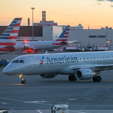 A rare American Airlines Embraer E190 taxis into...