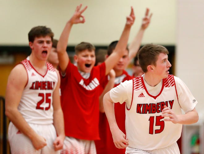 The Kimberly bench celebrates a 3-point basket by teammate Charlie Jacobson during their game against Kaukauna on Friday in Kimberly.
Danny Damiani/USA TODAY NETWORK-Wisconsin