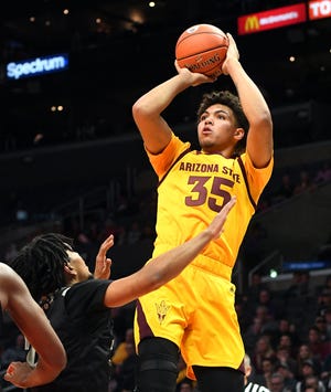 Dec 7, 2018:  Nevada Wolf Pack guard Jazz Johnson (22) defends Arizona State Sun Devils forward Taeshon Cherry (35) as he shoots the ball in the first half of the game at Staples Center.