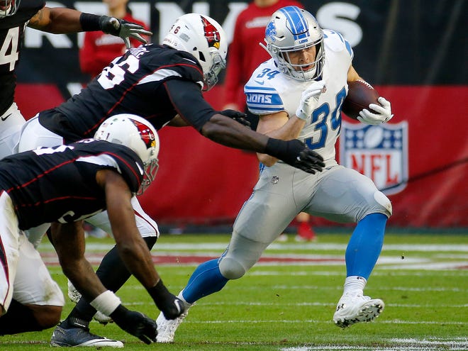 Running back Zach Zenner (34) led the Lions with 54 yards on 12 carries.