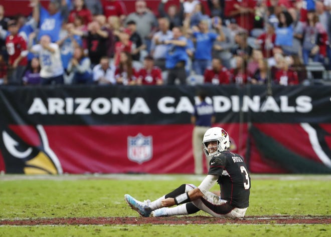 Arizona Cardinals quarterback Josh Rosen (3) sits on the ground after throwing an interception against the Detroit Lions that was returned for a touchdown during the second half in Glendale, Ariz. December 9.