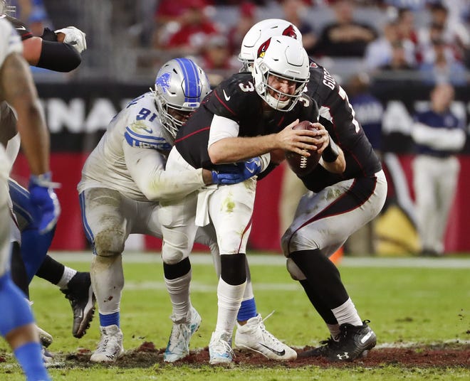 Arizona Cardinals quarterback Josh Rosen (3) is sacked by Detroit Lions defensive tackle A'Shawn Robinson (91) during the second half in Glendale, Ariz. December 9.