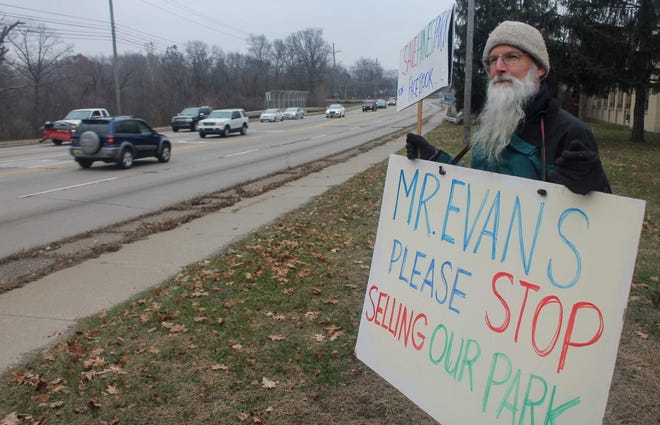 Livonia resident Bill Craig stands outside the Newburgh Mill at Newburgh and Hines Drive in Livonia. Craig and other Wayne County residents are protesting the sale of three mills in Livonia, Plymouth Township and Northville.