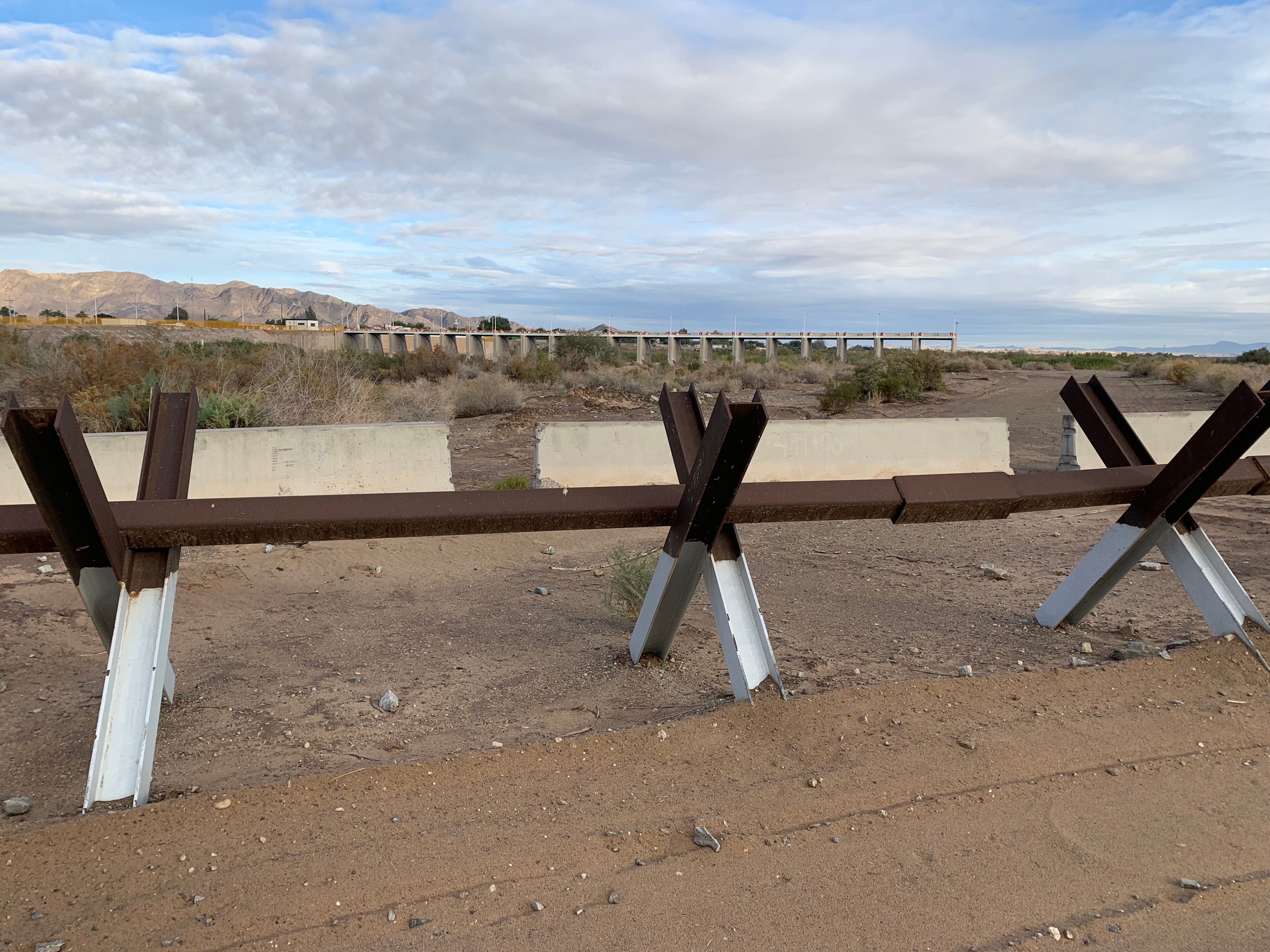 Migrants skirt border fortifications, cross largely unimpeded at the Colorado River