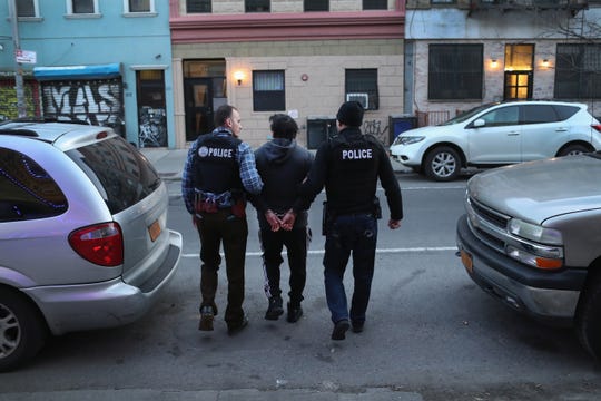 In this 2018 file photo, U.S. Immigration and Customs Enforcement officers arrest an undocumented Mexican immigrant during a raid in the Bushwick neighborhood of Brooklyn, New York.