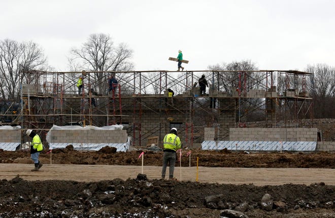 Construction crews work at the site of the General Sherman Junior High School Wednesday afternoon, Dec. 6, 2018, on Election House Road in Lancaster.