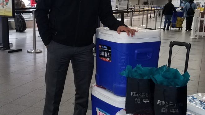 Christian Lopez, Convention Sales Manager with Visit El Paso, checked into the El Paso International Airport Wednesday morning with 700 tamales.