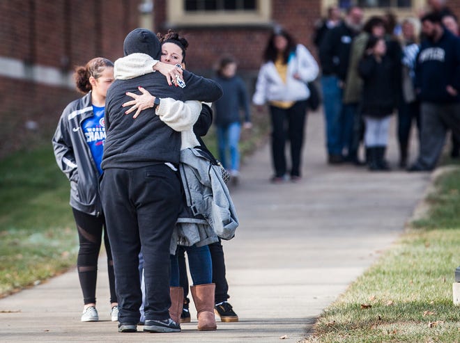 Hundreds of families waited to reunite with children at the Civic Hall Performing Arts Center where students waited after being bussed from Dennis Intermediate School following a shooting Thursday morning. 