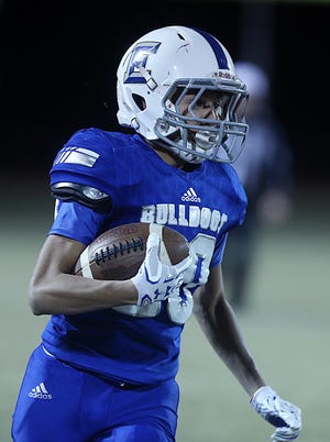 Eden's Eli Eureste (20) runs the ball for the Bulldogs. Eden lost to Jonesboro 46-36 on Friday, Nov. 22, 2019, in the second round of the playoffs.