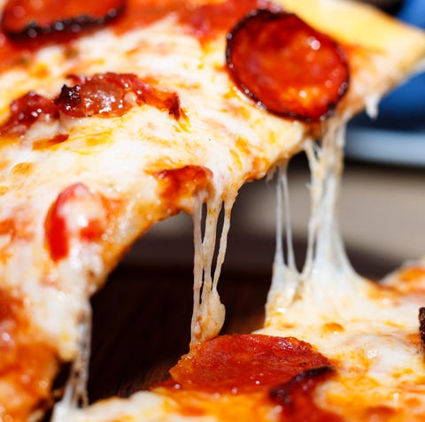 Closeup of a piece of pepperoni pizza. Italian piz