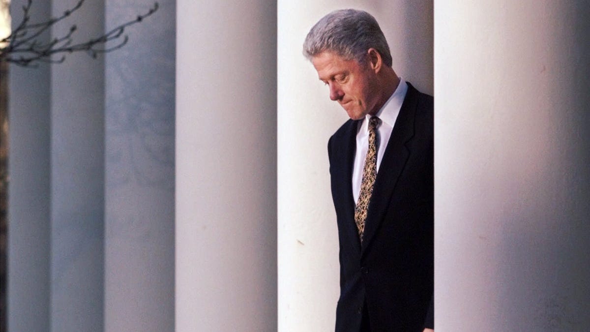President Clinton walks to the podium to deliver a short statement on the impeachment inquiry in the Rose Garden of the White House in Washington Friday, Dec. 11, 1998.  