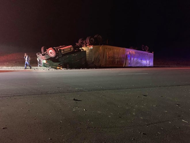 A truck loaded with potato chips and food products overturned Thursday evening on Highway 64.