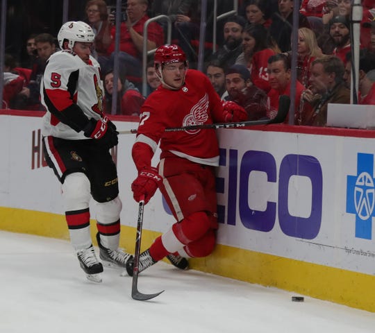 The Detroit Red Wings center Michael Rasmussen is checked by Ottawa Senators defenceman Cody Ceci during first period action Friday, December 14, 2018 at Little Caesars Arena in Detroit, Mich.