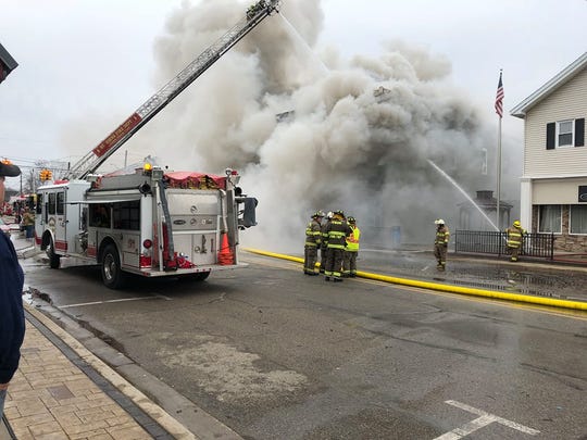Fire crews battle a structure fire in downtown Fowler on Saturday.