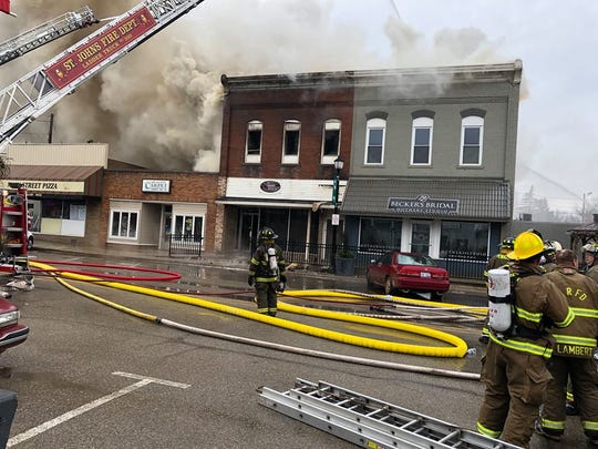 Fire crews battle a structure fire in downtown Fowler on Saturday.