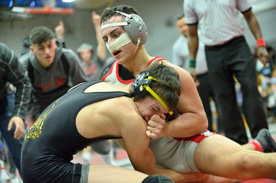 Fair Lawn's AJ Puerto, grey, wrestles Cresskill's Kenny Spadaccini in the 152 pound class at the Cutter Classic wrestling tournament in Fair Lawn on Saturday, Dec. 15, 2018