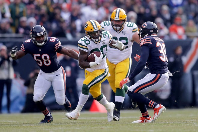 Green Bay Packers running back Jamaal Williams runs with the ball during the 1st half of the Green Bay Packers game against the Chicago Bears at Soldier Field Sunday, Dec. 16, 2018, in Chicago. Photo by Mike De Sisti / The Milwaukee Journal Sentinel