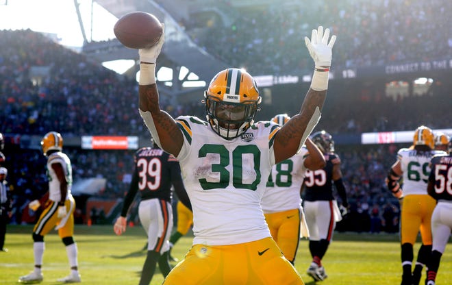 Green Bay Packers running back Jamaal Williams (30) celebrates his touchdown on a 10-yard run during the third  quarter of their game against the Chicago Bears Sunday, December 25, 2018 at Soldier Field in Chicago, Ill. The Chicago Bears beat the Green Bay Packers 24-17.

MARK HOFFMAN/MILWAUKEE JOURNAL SENTINEL