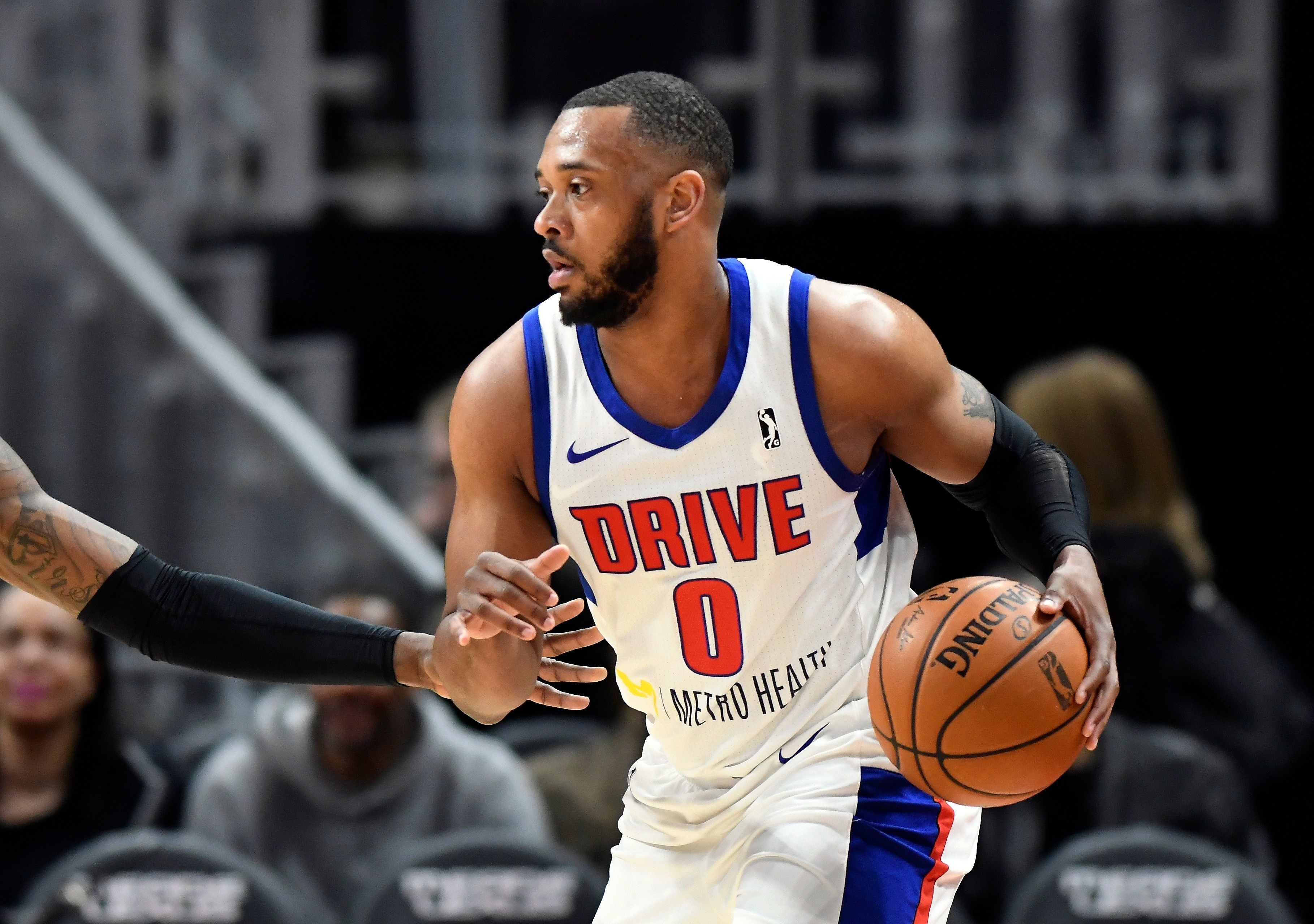 In a photo from Feb. 28, 2018, Grand Rapids Drive forward Zeke Upshaw looks to pass during a basketball game in Detroit. Upshaw, the Detroit Pistons developmental player who collapsed on the court during a NBA G League game in Michigan has died. The Grand Rapids Drive says 26-year-old Upshaw died at a hospital Monday, March 26, 2018. No cause was disclosed.