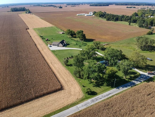 Surrounded by farming fields, this rural Carroll County home offers seclusion just outside of Rossville within a short drive of Lafayette.
