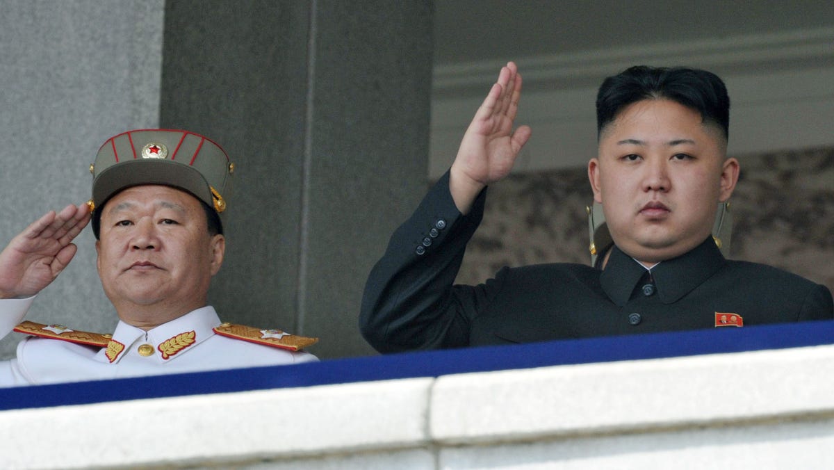 In this photo taken on April 15, 2012, North Korean leader Kim Jong Un, right, and Vice Marshal Choe Ryong Hae salute during a mass military parade in Kim Il Sung Square to celebrate the centenary of the birth of his grandfather, national founder Kim Il Sung in Pyongyang, North Korea.