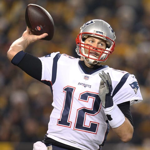 New England Patriots quarterback Tom Brady (12)...