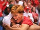 Wisconsin's Maurice Linton hugs his mother, Cynthia, in the stands to celebrate Wisconsin's victory over Purdue.