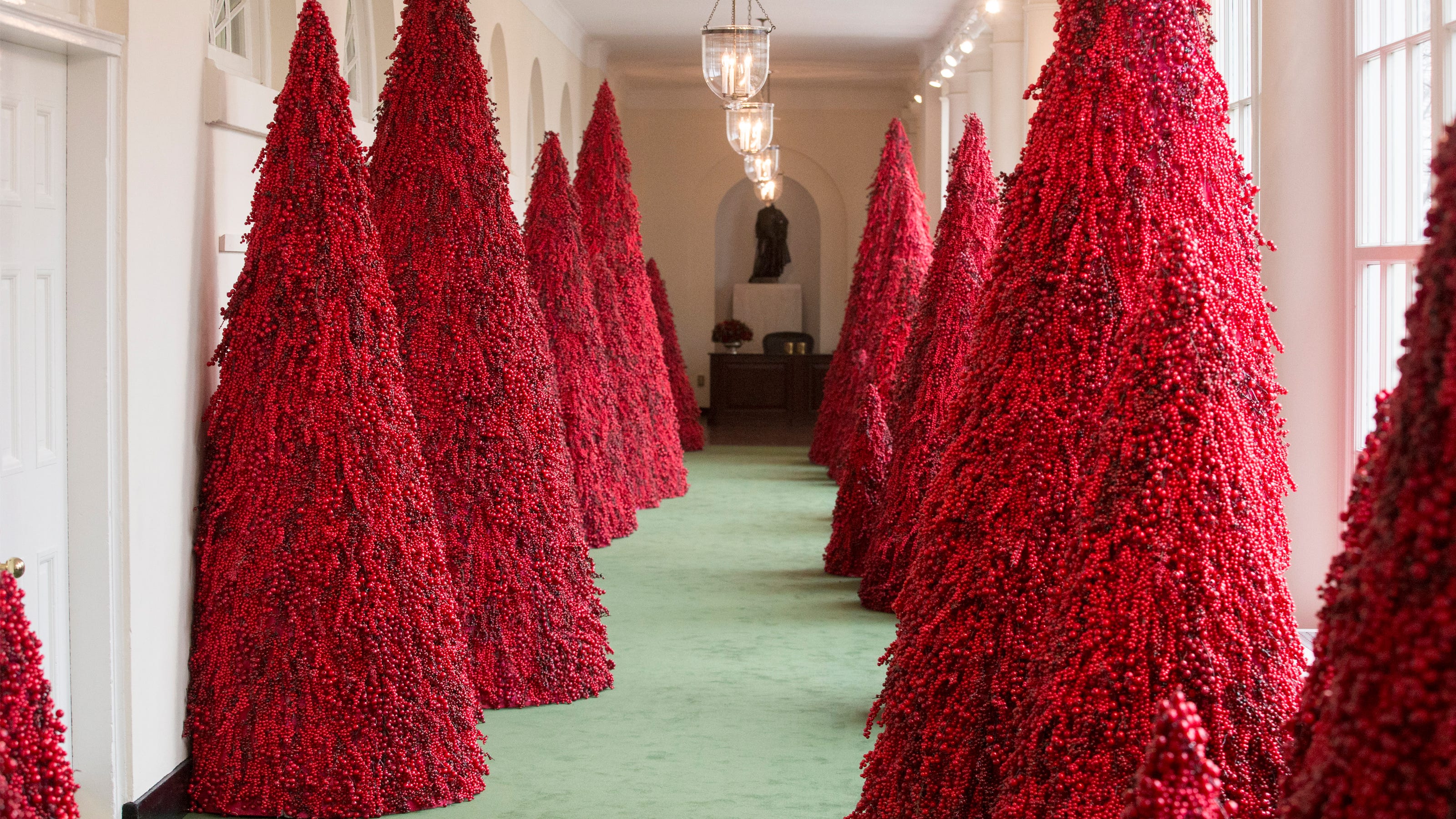 Melania Trump's controversial red trees a hit at Christmas parties