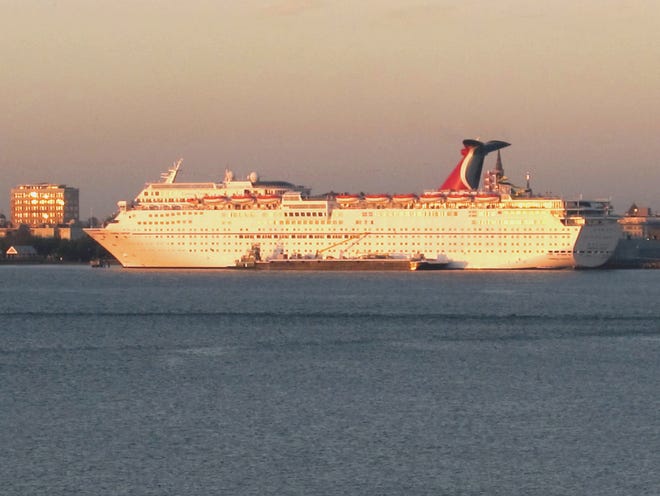 In this Jan. 25, 2012 file  photo, the Carnival Fantasy rests at its berth just after dawn in Charleston, S.C.