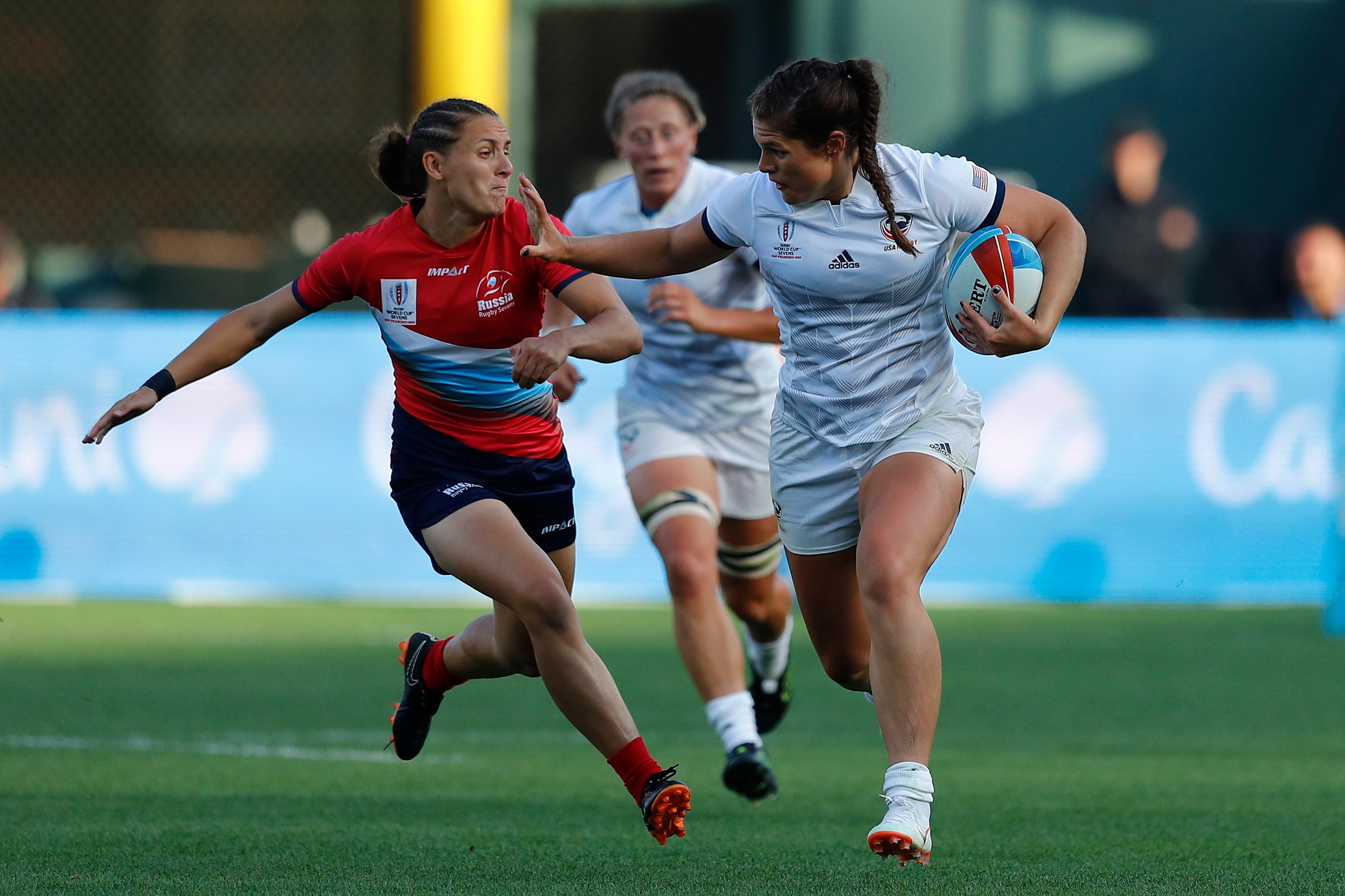 USA's Ilona Maher fends off the Russia defense on day one of the Rugby World Cup Sevens 2018 at AT&T Park in San Francisco on 20th July, 2018.