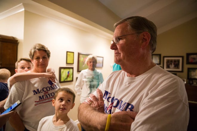 Joe McComb waits for election results with his family, including wife Mary McComb and grandsons Alex, 11 (left) and Kyle McComb. Complete unofficial elections returns show he garnered 59.99 percent of the mayoral vote.