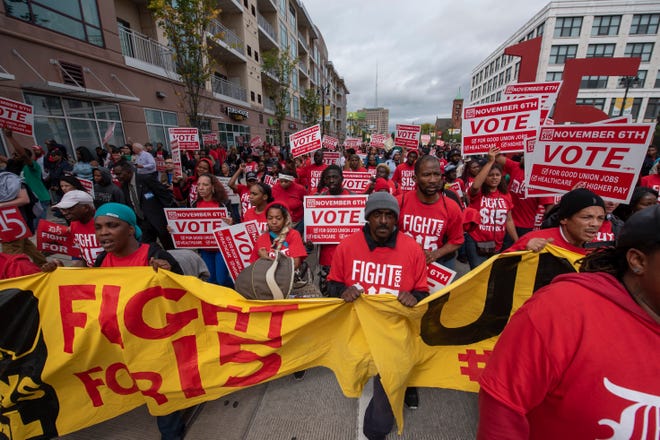 Demonstrators march down Woodward Avenue in Detroit, advocating a raise in the minimum wage to $15 an hour and demanding a union at fast food restaurants in October.