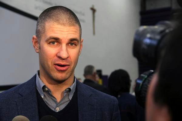 Minnesota Twins' Joe Mauer speaks to reporters at his alma mater Cretin-Derham Hall High School Tuesday. The Twins will retire Mauer's No. 7 jersey next season, moving swiftly with to honor the six-time All-Star who retired after a 15-year major league career.