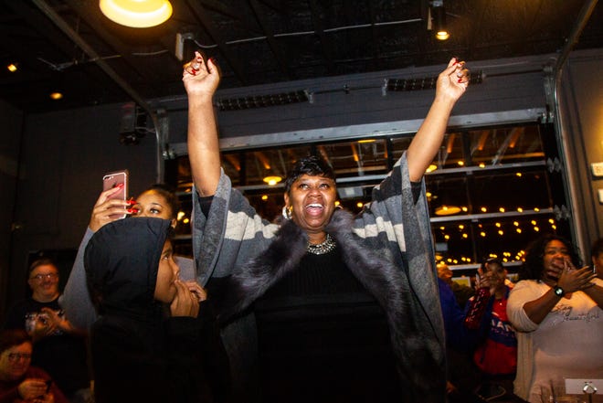 Royceann Porter celebrates with supporters following her victory for Johnson County Supervisor during at a special election watch party on Tuesday, Dec. 18, 2018, at Big Grove Brewery in Iowa City.