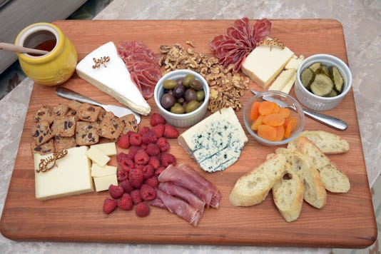 A charcuterie board with meats and cheeses is ideal for a January party