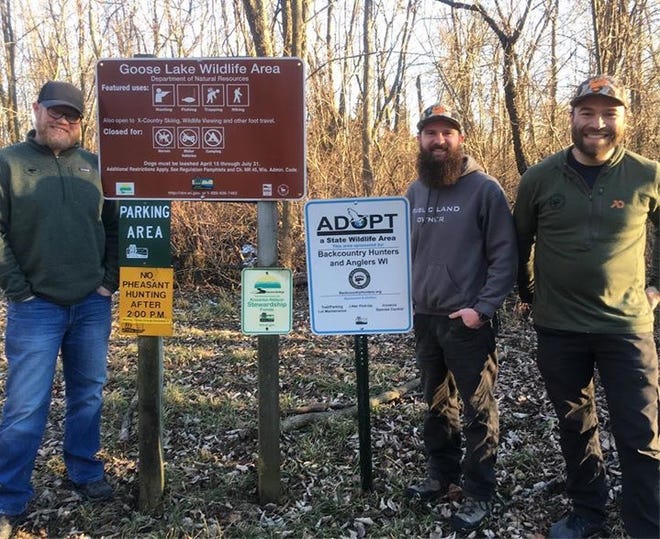 Land Tawney, Bryce Schmidt and Jason Meekhof (left to right), members of Backcountry Hunters & Anglers, pose for a photo during a visit to Goose Lake Wildlife Area near Marshall. Volunteers with the organization assist the Department of Natural Resources with maintenance and management projects at the public site.