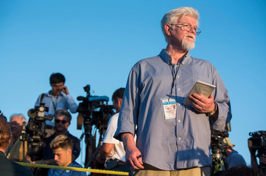 June 28, 2018: Pat Furgurson, staff reporter of the Capital Gazette, reports outside the scene of a shooting at the Capital Gazette building in Annapolis, Md. Five newspaper employees were killed and several injured in the shooting.