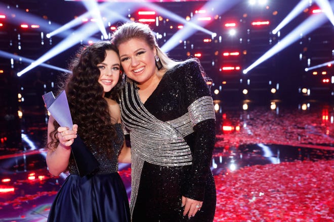 Chevel Shepherd, left, and her coach, Kelly Clarkson, stand on the confetti-covered stage of 'The Voice' minutes after Shepherd was named the Season 15 champion.