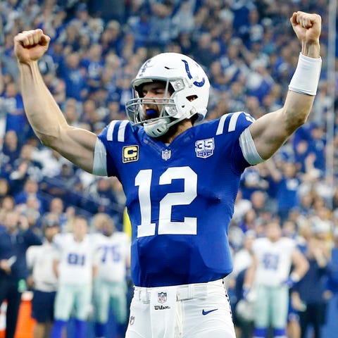 Andrew Luck celebrates a touchdown in the Colts'...