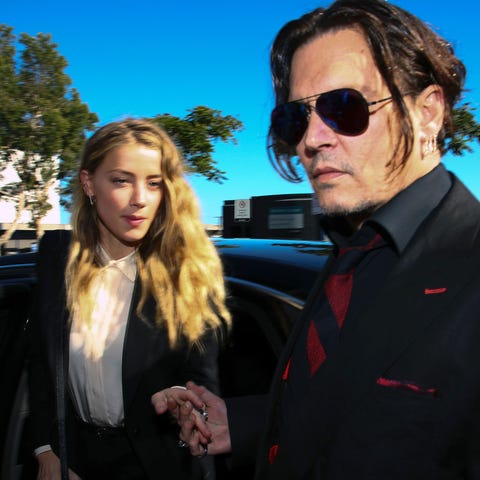 Johnny Depp and his wife Amber Heard arriving at a