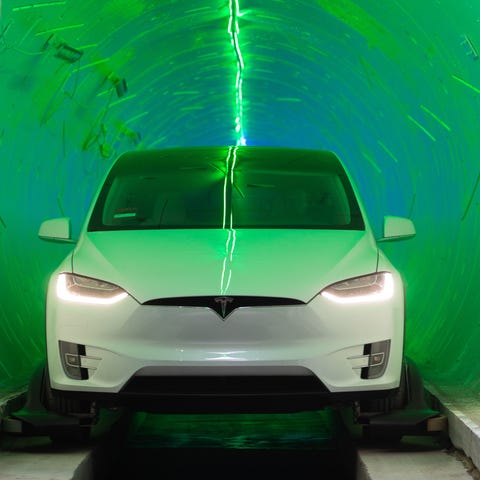 A Tesla Model X SUV in the Boring Co. tunnel in...