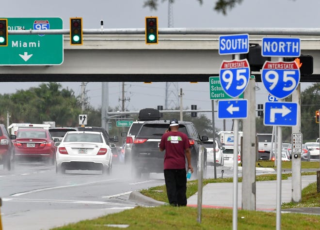 Rain soaked Wickham Road near 1-95 in Viera. Rainy conditions were expected to persist for the week in most of Brevard County.
