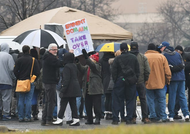 Workers gather for a vigil outside GM's Detroit-Hamtramck Assembly plant on Thursday.