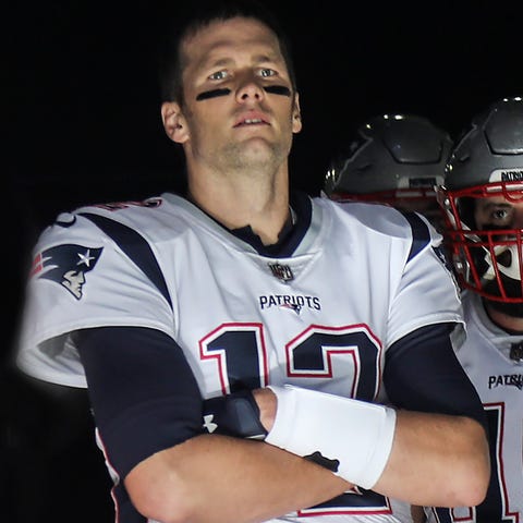 New England quarterback Tom Brady waits in the...