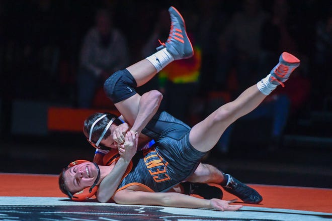 Spring Grove's Sam Meyer locks in the cradle on Brendan Smith of Central York during the 113 pound match, Wednesday, December 19, 2018.John A. Pavoncello photo	