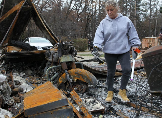 Tina Torres walks through her burned house on Tuesday. It was the first day she and other Paradise residents were allowed to return to their home sites since they were evacuated during the Camp Fire on Nov. 8, 2018. (Hung T. Vu/Special to the Record Searchlight)