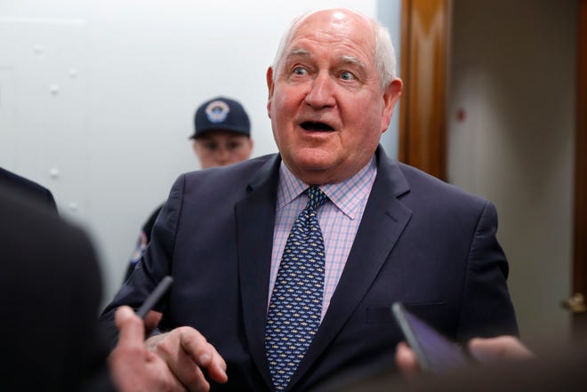 FILE: Secretary of Agriculture Sonny Perdue talks with reporters in April 2018.